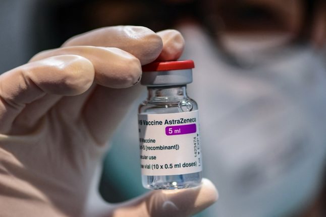 (FILES) In this file photo taken on March 09, 2021 A medical worker holds a vial of the British-Swedish AstraZeneca/Oxford vaccine during a vaccination campaign at the National Museum of Science and Technology Leonardo Da Vinci, which is currently hosting the anti-Covid vaccination campaign with Multimedica in Milan. - Denmark, Norway and Iceland on March 11, 2021 temporarily suspended the use of AstraZeneca's Covid-19 vaccine over concerns about patients developing post-jab blood clots, as the manufacturer and Europe's medicines watchdog insisted the vaccine was safe. Denmark was first to announce its suspension, "following reports of serious cases of blood clots" among people who had received the vaccine, the country's Health Authority said in a statement. (Photo by Miguel MEDINA / AFP)