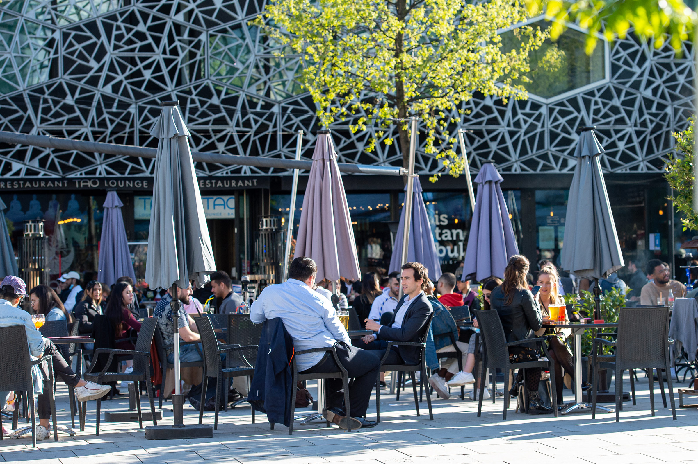 People sit outside at a restaurant in Lausanne, Switzerland, on May 3. Robert Hradil/Getty Images