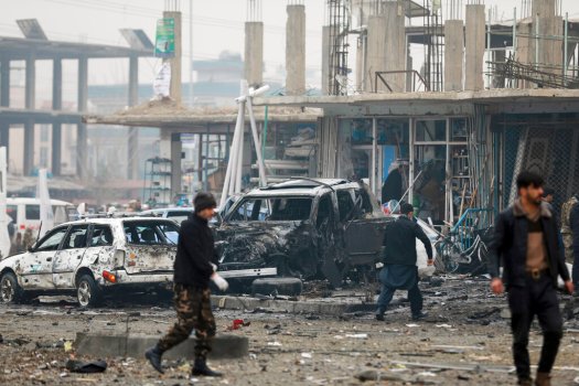 Afghan security personnel inspect the site of a bombing attack in Kabul, Afghanistan, Sunday, Dec. 20, 2020. The strong car bomb explosion rocked the capital Kabul city on Sunday morning, killing multiple people, said a government official. (AP Photo/Rahmat Gul)