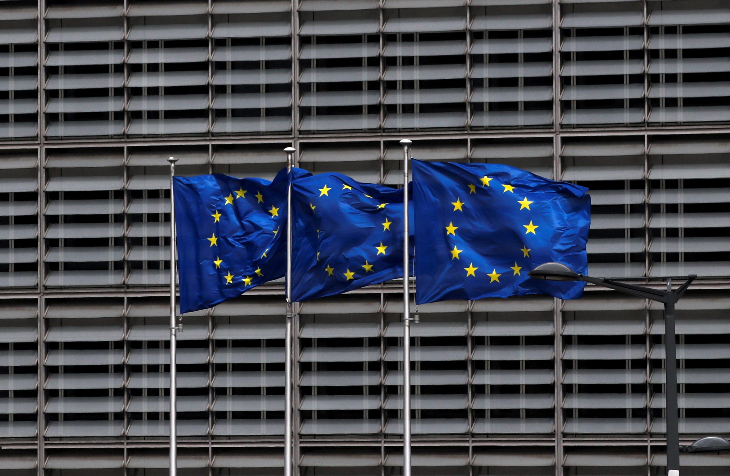 FILE PHOTO: European Union flags flutter outside the EU Commission headquarters in Brussels, Belgium May 5, 2021. REUTERS/Yves Herman/File Photo