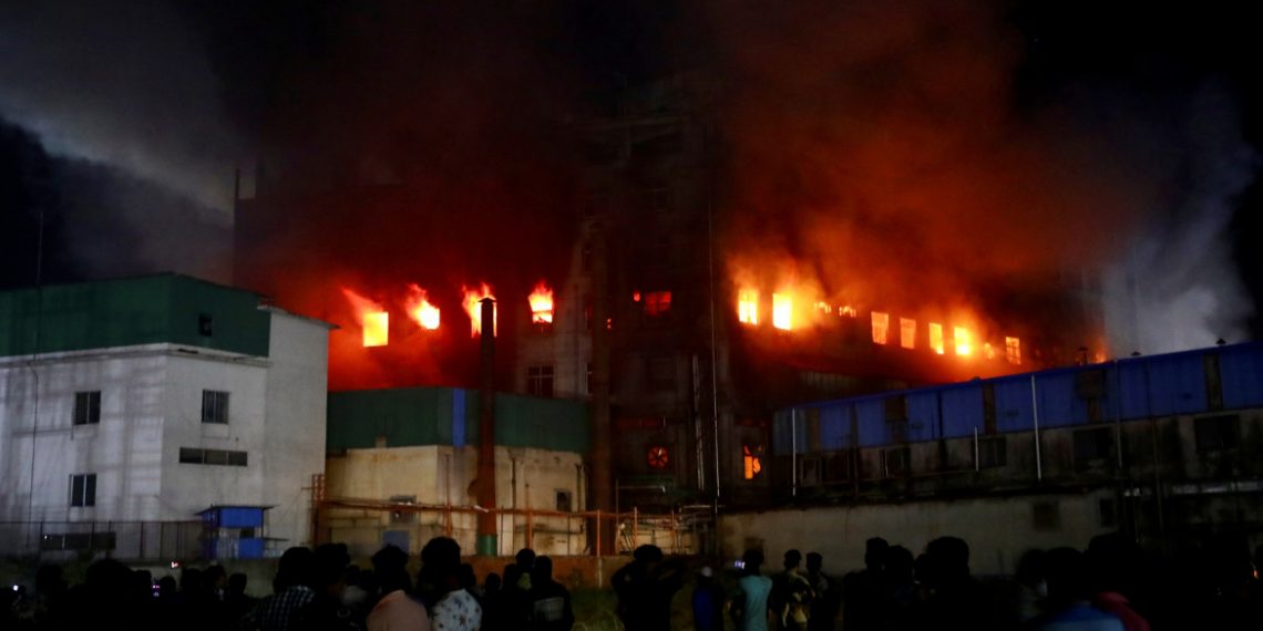 Flames rise after a fire broke out at a factory named Hashem Foods Ltd. in Rupganj of Narayanganj district, outskirts of Dhaka, Bangladesh, July 9, 2021. REUTERS/Mohammad Ponir Hossain