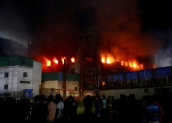 Flames rise after a fire broke out at a factory named Hashem Foods Ltd. in Rupganj of Narayanganj district, outskirts of Dhaka, Bangladesh, July 9, 2021. REUTERS/Mohammad Ponir Hossain