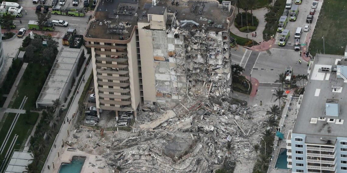 This aerial photo shows part of the 12-story oceanfront Champlain Towers South Condo that collapsed early Thursday, June 24, 2021 in Surfside, Fla.  (Amy Beth Bennett/South Florida Sun-Sentinel via AP)