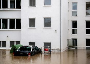 epa09343910 A flooded courtyard of an evacuated retirement home as heavy rain hits Hagen, Germany, 14 July 2021. Large parts of North Rhine-Westphalia were hit by heavy, continuous rain Tuesday evening. According to the German Weather Service (DWD), the rain is not expected to let up until 15 July. The Rhine level has risen significantly in recent days.  EPA-EFE/FRIEDEMANN VOGEL