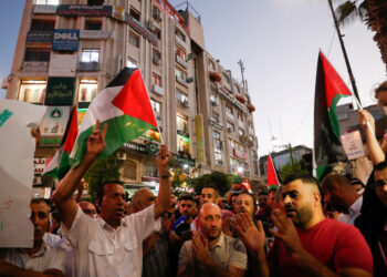 Demonstrators take part in a protest in solidarity with Palestinian prisoners in Israeli jails, in Ramallah in the Israeli-occupied West Bank September 8, 2021. REUTERS/Mohamad Torokman