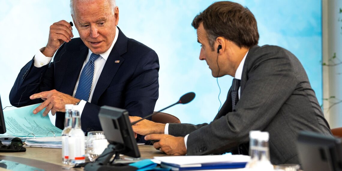 FILE PHOTO: U.S. President Joe Biden talks with French President Emmanuel Macron at the final session of the G7 summit in Carbis Bay, Cornwall in Britain, June 13, 2021.  Doug Mills/Pool via REUTERS