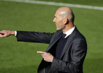 Real Madrid's head coach Zinedine Zidane gives instructions during a Spanish La Liga soccer match between Celta and Real Madrid at the Balaidos stadium in Vigo, Spain, Saturday March 20, 2021. (AP Photo/Lalo R.Villar)