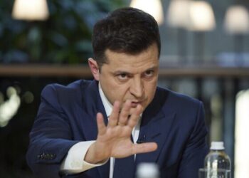 Ukrainian President Volodymyr Zelenskyy gestures while speaking to the media during a news conference in Kyiv, Ukraine, Friday, Nov. 26, 2021. (Ukrainian Presidential Press Office via AP)