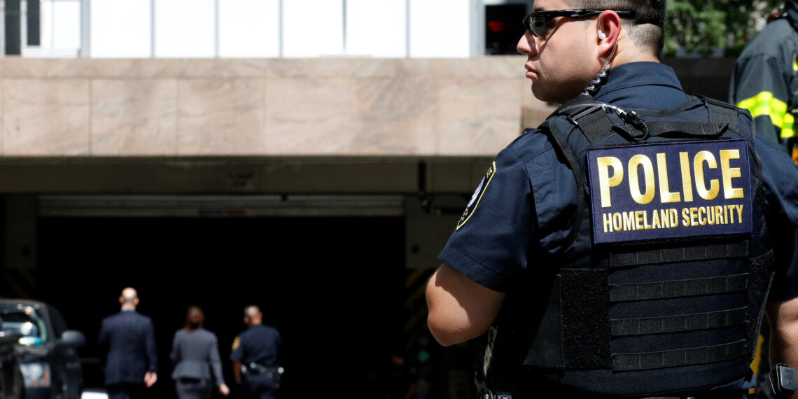 A Homeland Security officer stands in front of the parking garage of 26 Federal Plaza, following an incident where an FBI Agent was injured, in New York City, U.S., August 16, 2017. REUTERS/Brendan McDermid