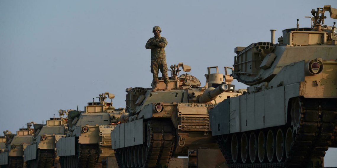 US Army personnel offload military equipment at the Mihail Kogalniceanu Air Base near Constanta in Romania on February 14, 2017. - Soldiers and equipment from the 3rd Armored Brigade Combat Team, 4th Infantry Division, arrived at the Mihail Kogalniceanu Air Base as part of the ongoing Atlantic Resolve mission. The combined arms unit of the "Fighting Eagles" brings a full complement of 500 US troops, a US Army infantry battalion's M1 Abrams tanks, M2 Bradley fighting vehicles, and M109A6 Paladin self-propelled howitzers to Romania. (Photo by DANIEL MIHAILESCU / AFP)