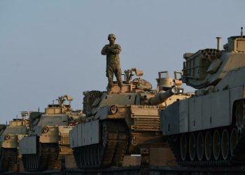 US Army personnel offload military equipment at the Mihail Kogalniceanu Air Base near Constanta in Romania on February 14, 2017. - Soldiers and equipment from the 3rd Armored Brigade Combat Team, 4th Infantry Division, arrived at the Mihail Kogalniceanu Air Base as part of the ongoing Atlantic Resolve mission. The combined arms unit of the "Fighting Eagles" brings a full complement of 500 US troops, a US Army infantry battalion's M1 Abrams tanks, M2 Bradley fighting vehicles, and M109A6 Paladin self-propelled howitzers to Romania. (Photo by DANIEL MIHAILESCU / AFP)