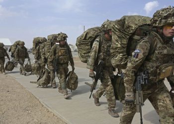 British troops prepare to depart upon the end of operations for U.S. Marines and British combat troops in Helmand October 27, 2014. A fleet of planes and helicopters airlifted the last U.S. and British forces from a key base in southern Afghanistan on Monday, a day after the international coalition closed the massive facility and handed it over to the Afghan military. REUTERS/Omar Sobhani (AFGHANISTAN - Tags: MILITARY CONFLICT POLITICS) - RTR4BR8C