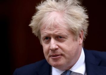 FILE PHOTO: British Prime Minister Boris Johnson walks outside Downing Street in London, Britain, February 2, 2022. REUTERS/Henry Nicholls/File Photo