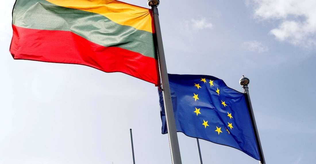 FILE PHOTO: European Union and Lithuanian flags flutter at border crossing point in Medininkai, Lithuania September 18, 2020. REUTERS/Ints Kalnins/File Photo