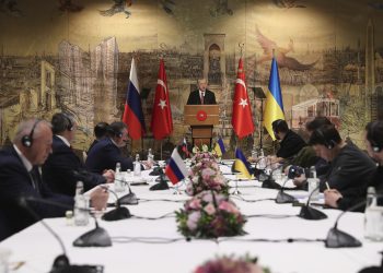 In this photo provided by Turkish Presidency, Turkish President Recep Tayyip Erdogan, center, gives a speech to welcome the Russian, left, and Ukrainian delegations ahead of their talks, in Istanbul, Turkey, Tuesday, March 29, 2022. The first face-to-face talks in two weeks between Russia and Ukraine were due to start Tuesday, raising flickering hopes of an end to a war that has ground into a bloody campaign of attrition. (Turkish Presidency via AP)