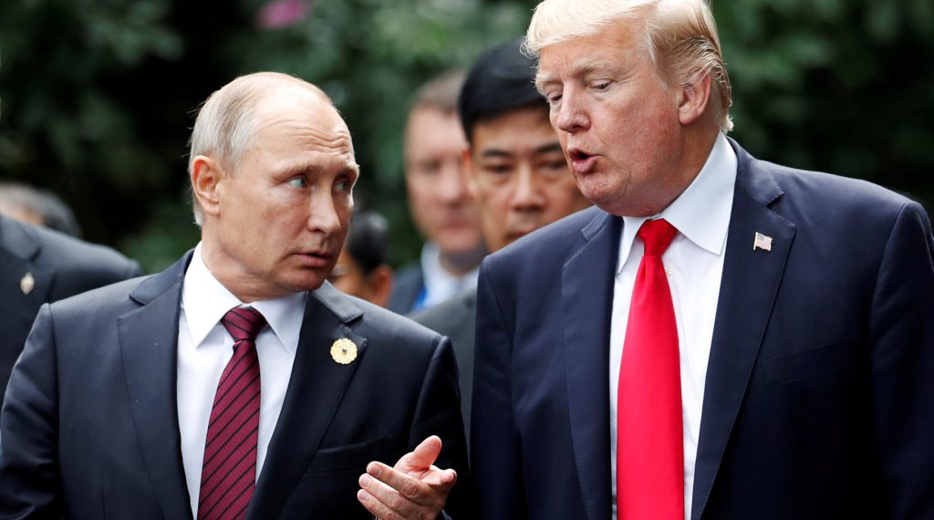 FILE PHOTO: U.S. President Donald Trump and Russia's President Vladimir Putin talk during the family photo session at the APEC Summit in Danang, Vietnam November 11, 2017. REUTERS/Jorge Silva/File Photo - RC1287F1C9B0