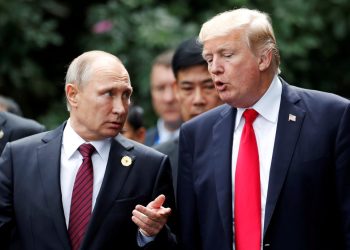 FILE PHOTO: U.S. President Donald Trump and Russia's President Vladimir Putin talk during the family photo session at the APEC Summit in Danang, Vietnam November 11, 2017. REUTERS/Jorge Silva/File Photo - RC1287F1C9B0