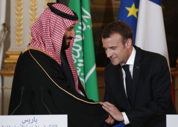 French President Emmanuel Macron, right, and Saudi Arabia Crown Prince Mohammed bin Salman, attend a press conference at the Elysee Palace in Paris, Tuesday, April 10, 2018. Macron meets with Prince Mohammed in Paris to bolster economic ties and strengthen cooperation on security and defense between the two countries. (Yoan Valat/Pool via AP)