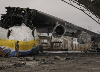 FILE - A Ukrainian serviceman walks by the Antonov An-225 Mriya aircraft destroyed during fighting between Russian and Ukrainian forces on the Antonov airport in Hostomel, Ukraine, April 2, 2022. Kyiv was a Russian defeat for the ages. It started poorly for the invaders and went downhill from there.  (AP Photo/Vadim Ghirda, File)