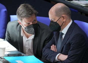 German Economy and Climate Minister Robert Habeck, left, and German Chancellor Olaf Scholz, right, attend a budget debate as part of a meeting of the German federal parliament, Bundestag, at the Reichstag building in Berlin, Germany, Wednesday, March 23, 2022. (Michael Kappeler/dpa via AP)