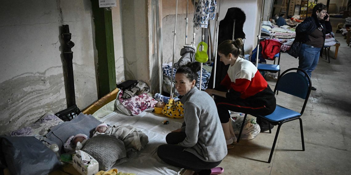 Women look after their babies at the pediatrics center after the unit was moved to the basement of the hospital which is being used as a bomb shelter, in Kyiv on February 28, 2022. - The Russian army said on February 28, 2022, that Ukrainian civilians could "freely" leave the country's capital Kyiv and claimed its airforce dominated Ukraine's skies as its invasion entered a fifth day. (Photo by Aris Messinis / AFP) (Photo by ARIS MESSINIS/AFP via Getty Images)