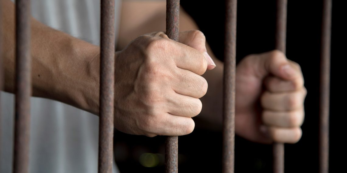 Hands of the prisoner in jail