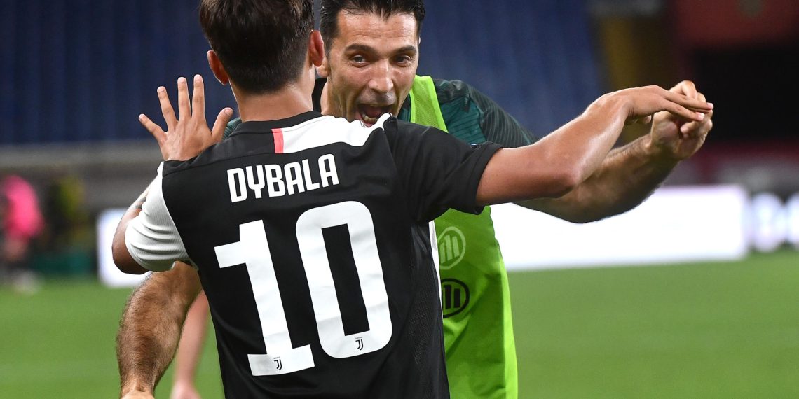 Juventus' Paulo Dybala (L) jubilates with his teammate Gianluigi Buffon  after scoring the 0-1 goal during the Italian Serie A soccer match Genoa CFC vs Juventus FC at Luigi Ferraris stadium in Genoa, Italy,  30 June 2020.
ANSA/LUCA ZENNARO