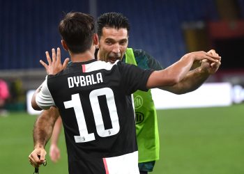 Juventus' Paulo Dybala (L) jubilates with his teammate Gianluigi Buffon  after scoring the 0-1 goal during the Italian Serie A soccer match Genoa CFC vs Juventus FC at Luigi Ferraris stadium in Genoa, Italy,  30 June 2020.
ANSA/LUCA ZENNARO