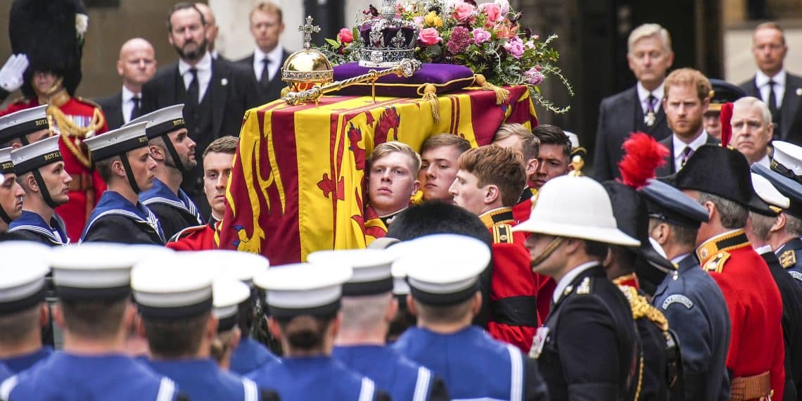 The coffin of Queen Elizabeth II is placed on a gun carriage during her funeral service in Westminster Abbey in central London Monday Sept. 19, 2022.The Queen, who died aged 96 on Sept. 8, will be buried at Windsor alongside her late husband, Prince Philip, who died last year. (AP Photo/Emilio Morenatti,Pool)