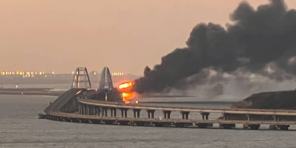 A view shows a fire on the Kerch bridge at sunrise in the Kerch Strait, Crimea, October 8, 2022.  REUTERS/Stringer