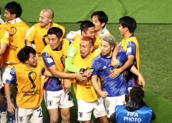 DOHA, QATAR - NOVEMBER 23: Takuma Asano of Japan celebrates scoring their second goal with their teammates during the FIFA World Cup Qatar 2022 Group E match between Germany and Japan at Khalifa International Stadium on November 23, 2022 in Doha, Qatar. (Photo by Robert Cianflone/Getty Images)