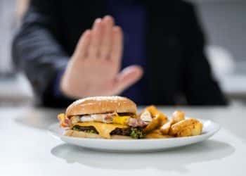 Close-up Of A Man's Hand Refusing To Eat Fest Food Burger,Image: 494078826, License: Royalty-free, Restrictions: , Model Release: yes, Credit line: Andriy Popov / Panthermedia / Profimedia