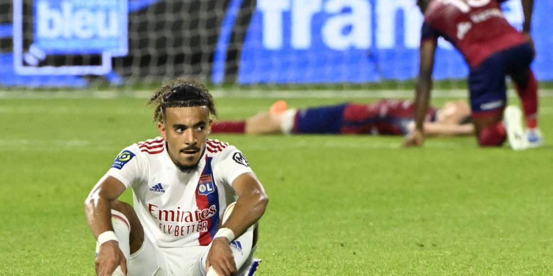 Lyon's French defender Malo Gusto (L) sits on the pitch at the end of the French L1 football match between Clermont Foot 63 and Olympique Lyonnais (OL) at Stade Gabriel Montpied in Clermont-Ferrand, central France on May 21, 2022. (Photo by THIERRY ZOCCOLAN / AFP) (Photo by THIERRY ZOCCOLAN/AFP via Getty Images)