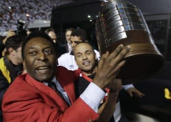 FILE - Former Brazilian soccer player Pele, left, celebrates at the end of the Copa Libertadores soccer final match between Brazil's Santos and Uruguay's Penarol in Sao Paulo, Brazil, June 22, 2011. Santos won 2-1. Pelé, the Brazilian king of soccer who won a record three World Cups and became one of the most commanding sports figures of the last century, died in Sao Paulo on Thursday, Dec. 29, 2022. He was 82. (AP Photo/Andre Penner, File)