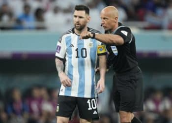 Referee Szymon Marciniak gestures as he speaks with Argentina's Lionel Messi during the World Cup round of 16 soccer match between Argentina and Australia at the Ahmad Bin Ali Stadium in Doha, Qatar, Saturday, Dec. 3, 2022. (AP Photo/Jorge Saenz)