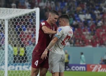 Serbia's Nikola Milenkovic, left, pushes Switzerland's Granit Xhaka during the World Cup group G soccer match between Serbia and Switzerland, in Doha, Qatar, Friday Dec. 2, 2022. (AP Photo/Ricardo Mazalan)