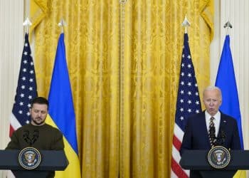 Ukrainian President Volodymyr Zelenskyy listens as President Joe Biden speaks during a news conference in the East Room of the White House in Washington, Wednesday, Dec. 21, 2022. (AP Photo/Andrew Harnik)