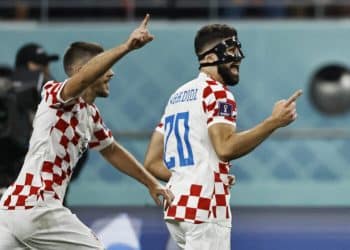 Soccer Football - FIFA World Cup Qatar 2022 - Third-Place Playoff - Croatia v Morocco - Khalifa International Stadium, Doha, Qatar - December 17, 2022 Croatia's Josko Gvardiol celebrates scoring their first goal with Andrej Kramaric REUTERS/Hamad I Mohammed