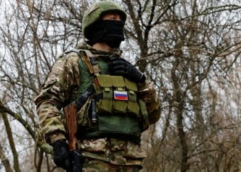 A Russian service member stands at a combat position in the course of Russia-Ukraine conflict, on the left bank of the Dnipro river in the Zaporizhzhia region, Russian-controlled Ukraine, November 26, 2022. REUTERS/Alexander Ermochenko