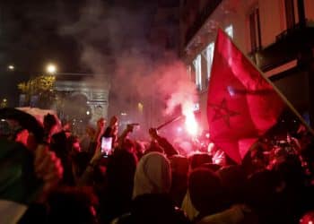 Soccer Football - FIFA World Cup Qatar 2022 - Fans gather in Paris for Morocco v Portugal - Paris, France - December 10, 2022 Morocco fans celebrate after the match as Morocco progress to the semi finals REUTERS/Benoit Tessier