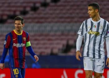 Barcelona's Lionel Messi, left, and Juventus' Cristiano Ronaldo during the Champions League group G soccer match between FC Barcelona and Juventus at the Camp Nou stadium in Barcelona, Spain, Tuesday, Dec. 8, 2020. (AP Photo/Joan Monfort)