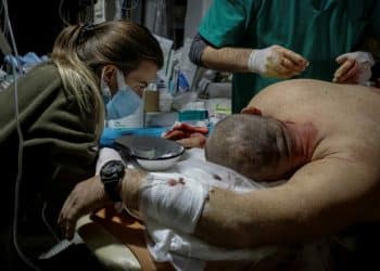 SENSITIVE MATERIAL. THIS IMAGE MAY OFFEND OR DISTURB Healthcare workers treat a wounded Ukrainian serviceman in a pre-hospital medical aid centre, as Russia's attack on Ukraine continues, in Donetsk region, Ukraine November 22, 2022.  Radio Free Europe/Radio Liberty/Serhii Nuzhnenko via REUTERS