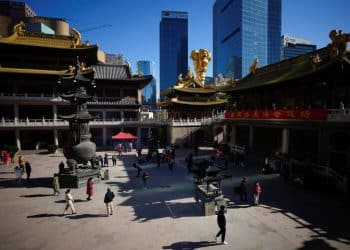 People wearing protective masks worship at the Buddhist Jing'an Temple, as coronavirus disease (COVID-19) outbreaks continue in Shanghai, China, December 23, 2022. REUTERS/Aly Song