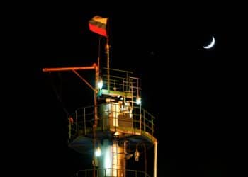 FILE PHOTO: A Russian state flag flies on the top of a diesel plant in the Yarakta Oil Field, owned by Irkutsk Oil Company (INK), in Irkutsk Region, Russia March 10, 2019. REUTERS/Vasily Fedosenko/File Photo