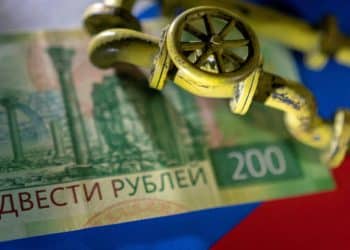 FILE PHOTO: A model of the natural gas pipeline is placed on Russian Rouble banknote and a flag in this illustration taken, March 23, 2022. REUTERS/Dado Ruvic/Illustration/File Photo