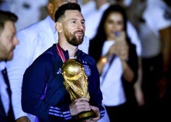 BUENOS AIRES, ARGENTINA - DECEMBER 20:  Lionel Messi holds the FIFA World Cup during the arrival of the Argentina men's national football team after winning the FIFA World Cup Qatar 2022 on December 20, 2022 in Buenos Aires, Argentina. (Photo by Marcelo Endelli/Getty Images)