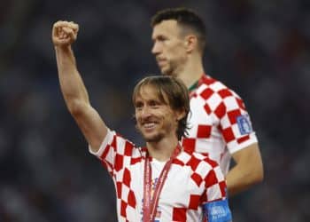 Soccer Football - FIFA World Cup Qatar 2022 - Third-Place Playoff - Croatia v Morocco - Khalifa International Stadium, Doha, Qatar - December 17, 2022 Croatia's Luka Modric celebrates with his medal on stage as they finish in third place REUTERS/Peter Cziborra