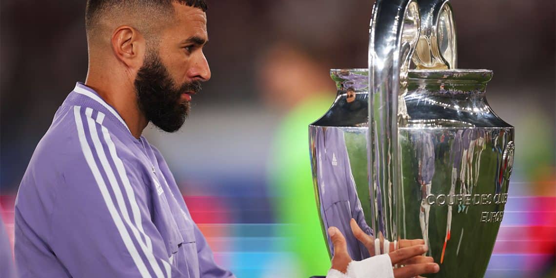 HELSINKI, FINLAND - AUGUST 10: Karim Benzema of Real Madrid carries the UEFA Champions League trophy as they walk of the tunnel prior to kick off of the UEFA Super Cup Final 2022 between Real Madrid CF and Eintracht Frankfurt at Helsinki Olympic Stadium on August 10, 2022 in Helsinki, Finland. (Photo by Alex Grimm/Getty Images )