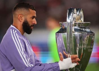 HELSINKI, FINLAND - AUGUST 10: Karim Benzema of Real Madrid carries the UEFA Champions League trophy as they walk of the tunnel prior to kick off of the UEFA Super Cup Final 2022 between Real Madrid CF and Eintracht Frankfurt at Helsinki Olympic Stadium on August 10, 2022 in Helsinki, Finland. (Photo by Alex Grimm/Getty Images )