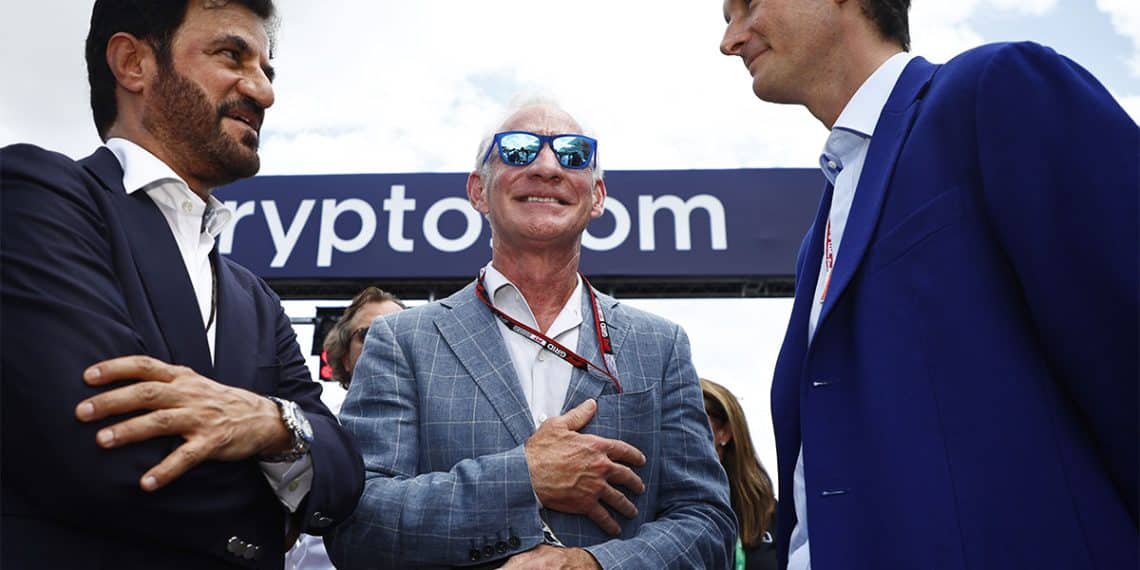 MIAMI, FLORIDA - MAY 08: Mohammed ben Sulayem, FIA President, Liberty Media boss Greg Maffei and Ferrari Chairman John Elkann talk on the grid during the F1 Grand Prix of Miami at the Miami International Autodrome on May 08, 2022 in Miami, Florida. (Photo by Jared C. Tilton/Getty Images)